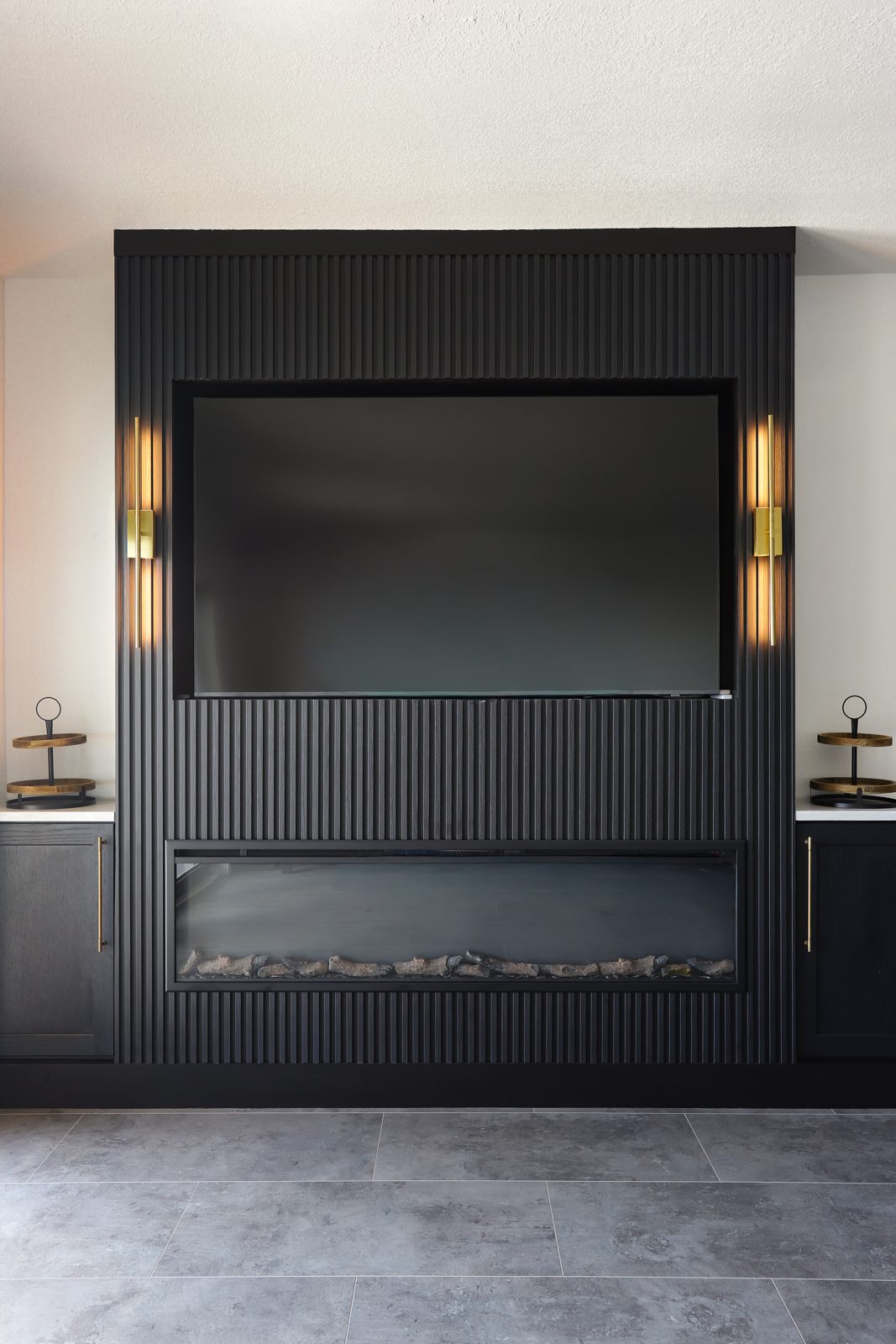 Modern fluted fireplace feature wall in a luxury Madeira Beach custom home interior